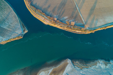 Aerial view of the Po river at the confluence with the Lambro river. Plain landscape in Lombardy (Italy).