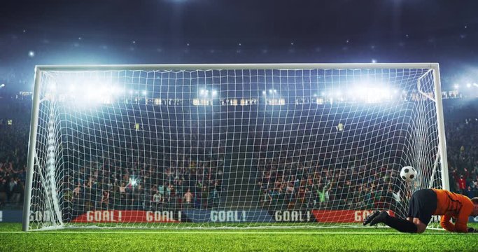 Goalkeaper fails to cath the ball on the professional football stadium. The ball flies with flames animation.