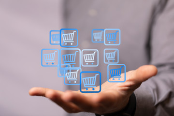 Businessman pressing modern technology panel shopping cart web phone credit card.