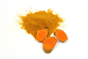 Turmeric powder and turmeric roots isolated on a white background are used as a tonic for the body...