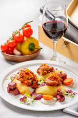 Romantic dinner with a glass of red wine and bottle in wooden box