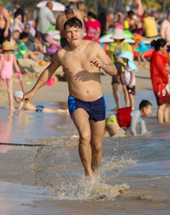 A man runs on the water on the seashore