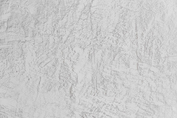 exture of concrete and plaster on the wall. Lines in the plaster. Texture of decorative plaster or stucco close up, abstract gray background.