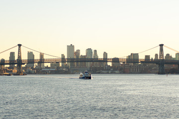 Fototapeta premium Williamsburg Bridge connecting Manhattan to Brooklyn New York over the East River during Sunset