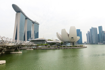 SINGAPORE - MARCH 23,2016 : The Helix Bridge, Artscience museum and Marina Bay Sands on MARCH 23,2016 in Singapore. Marina Bay is billed as the world's most expensive standalone casino property