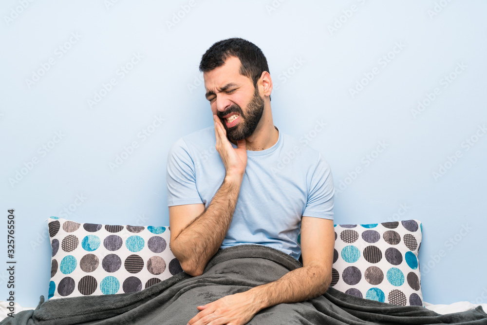 Wall mural Man in bed with toothache - Wall murals