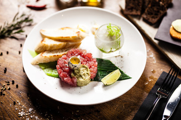Tuna tartare served on a plate in restaurant