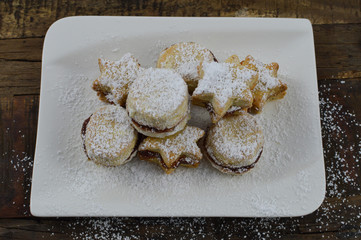 Serbian traditional homemade vanilla cookies(vanilice) with jam and powdered sugar
