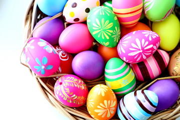 Fototapeta na wymiar easter eggs in basket on white background