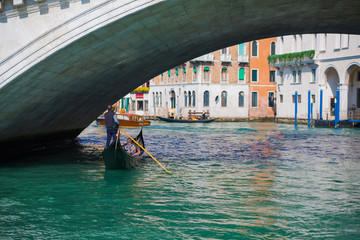 Traditional Gondolas passing over Bridge of Sighs in Venice, Italy