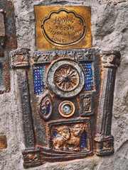 The smallest clock in the world on the wall of the Leaning Tower of Tbilisi, Georgia