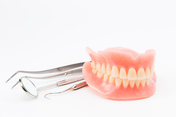 teeth and dental mirror, symbol photo of dentures, diagnosis and copayment