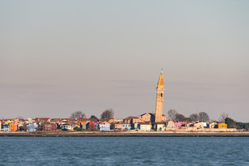 The leaning bell tower of Burano on a sunny day in winter