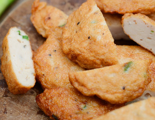 Cutting tasty hot fishcakes meal