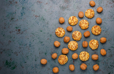 Homemade walnut cookies with walnuts on dark background,top view