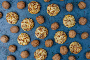 Homemade walnut cookies with walnuts on dark background,top view