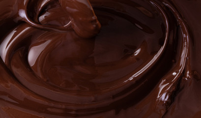Chocolate texture. Liquid chocolate close-up.Textured dark chocolate