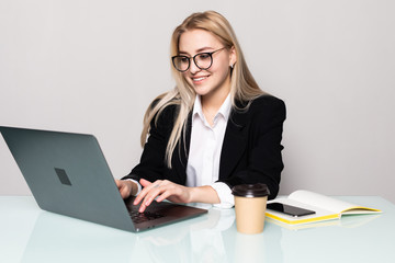 Young pretty business woman with notebook isolated on white background