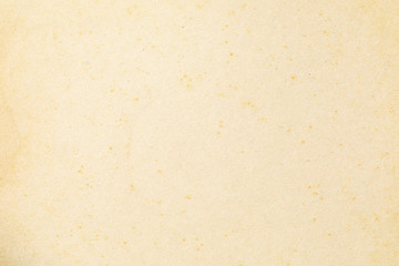 Brown kraft paper background texture with grain and dots 