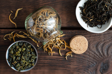 Chinese tea. Taiwanese tea. Oolong. Golden buds. Chinese black tea on wooden background.