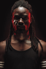 muscular african gangster man isolated over black background. photoshot of real emotions of black male model. mourning, mental suffering, facial expression, human nature and emotions concept