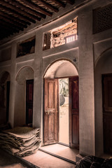 Door open to an open court inside a house