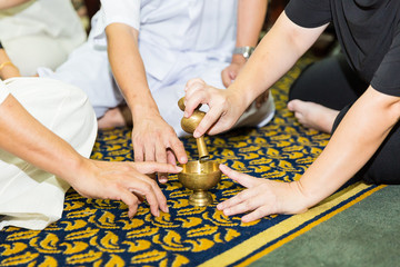 pouring water in funeral