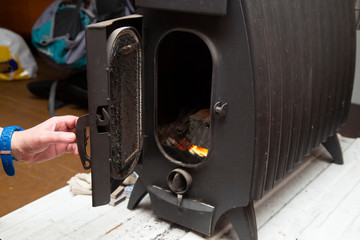 Iron wood burning stove. Iron stove for the house.