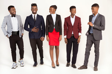 Fototapeta premium team of young african people in suits on a white background