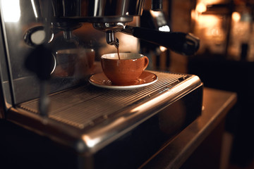 new modern model of electric coffeemaker. close up cropped photo, brewing coffee