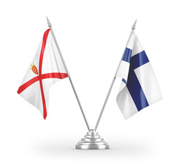 Finland and Jersey table flags isolated on white 3D rendering