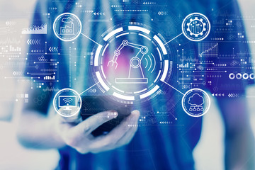 Smart industry concept with young man using a smartphone