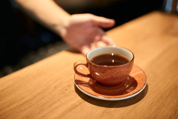 man offers good hot tea for tea lovers, good morning. beverage for mood. close up photo, help yourself