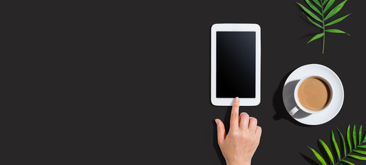 Person using a tablet computer from above