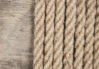 Vintage background with wooden log and hemp rope