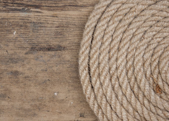 Vintage background with wooden log and hemp rope