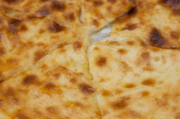 Khachapuri in Georgian. Khachapuri with cheese. Georgian traditional tortillas.