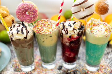 Milkshake with whipped cream and donuts