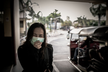 Asian traveler woman wear mask for protect coronavirus,Thai woman wearing face mask respiratory protect and filter pm2.5 (particulate matter)