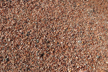 Red Sand and Stones of the red Sea Coast, Natural Texture Background