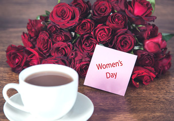 red roses with 8 march and cup of coffee
