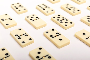 Photo of different dominoes. Background of dominoes. Hobbies collecting on white background.