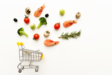Shopping cart with fresh products. © Svetlana Sotnikova