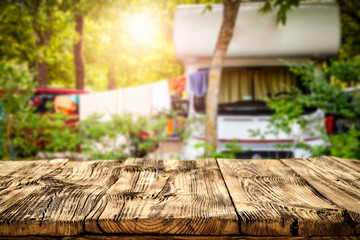 Summer landscape of camping and wooden table of free space for your decoration. 