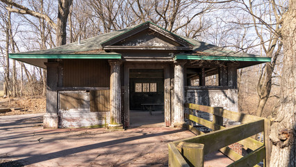 An old building from the work projects era in American history. Beautiful column and millwork decorate an old building in disrepair.