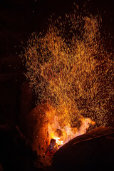 Smithy fire flame tips with sparks closeup