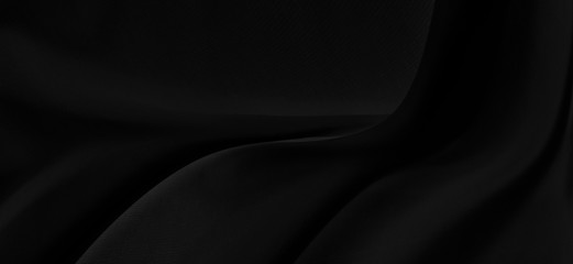 Black gray satin dark fabric texture luxurious shiny that is abstract silk cloth panorama background with patterns soft waves blur beautiful.
