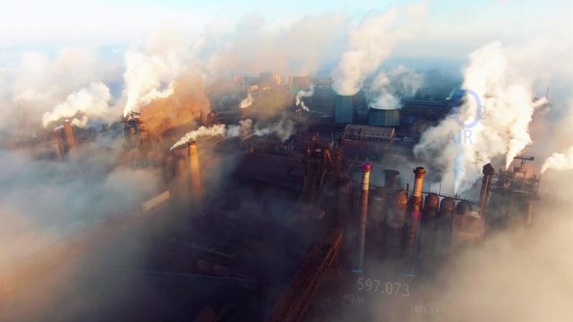 Animation. Aerial. View of high pipes with grey smoke with temperature change