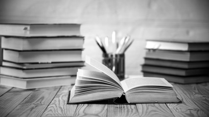Textbooks and books on a wooden table
