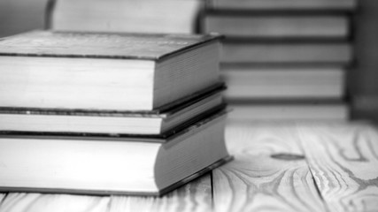 Textbooks and books on a wooden table